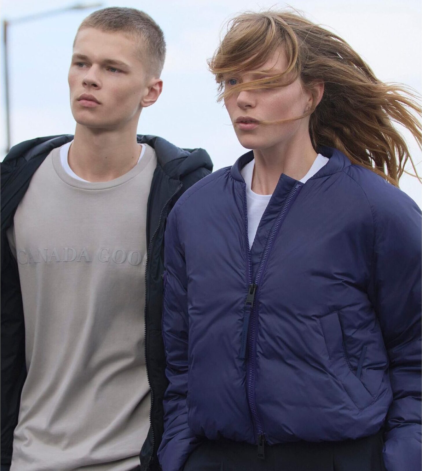 Model in Canada Goose bomber jacket, windswept