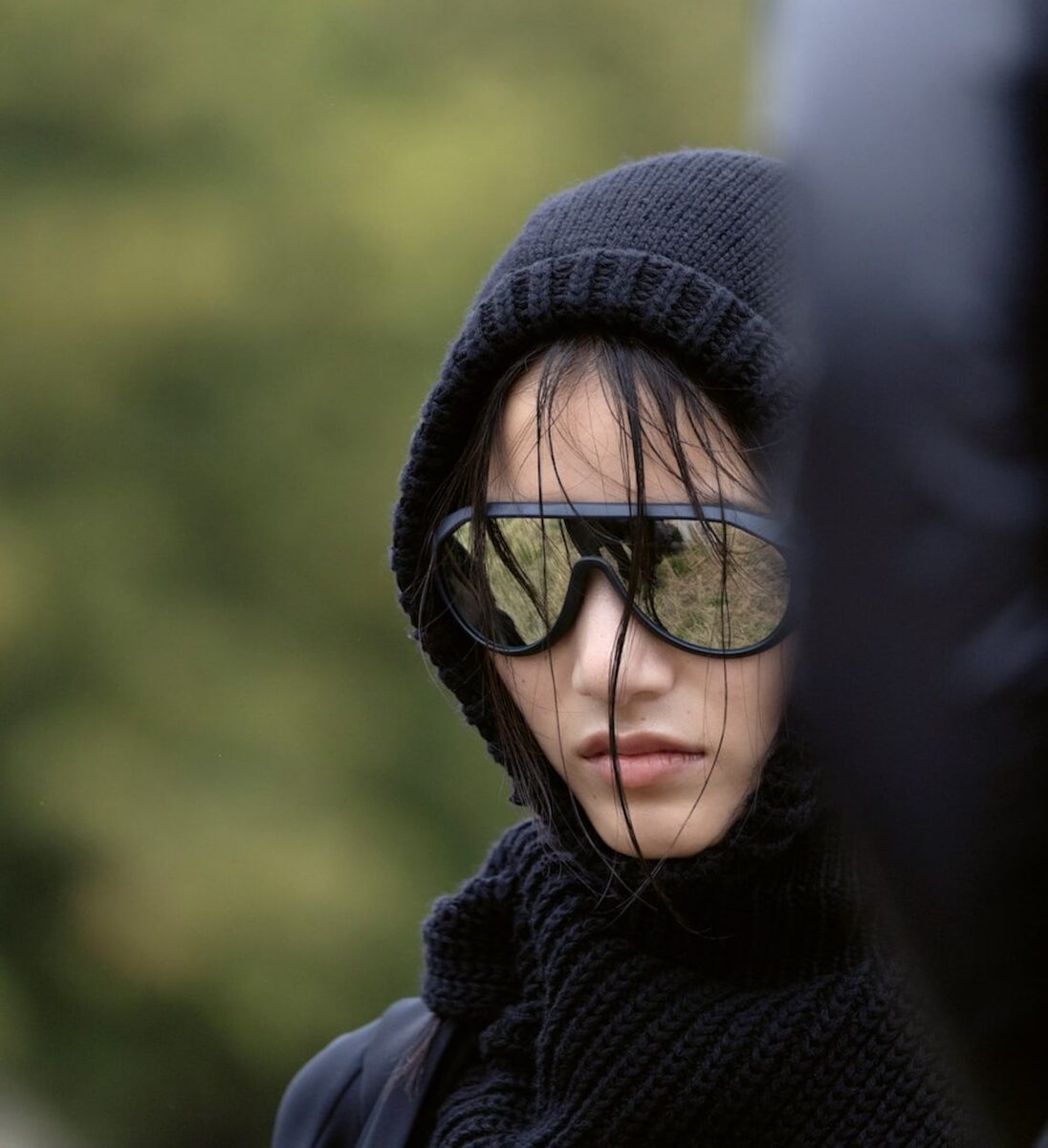 Close portrait, model in knit balaclava with mirrored ski goggles